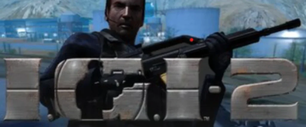 Cover art of Project IGI 2: Covert Strike featuring a soldier aiming a rifle, with industrial buildings and mountains in the background.

